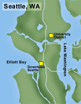 Text is black, land is green and water is blue, with a blue line running north to south. Elliot Bay and Lake Washington border the Seattle area, and the University District and Downtown Seattle are noted by yellow squares. 